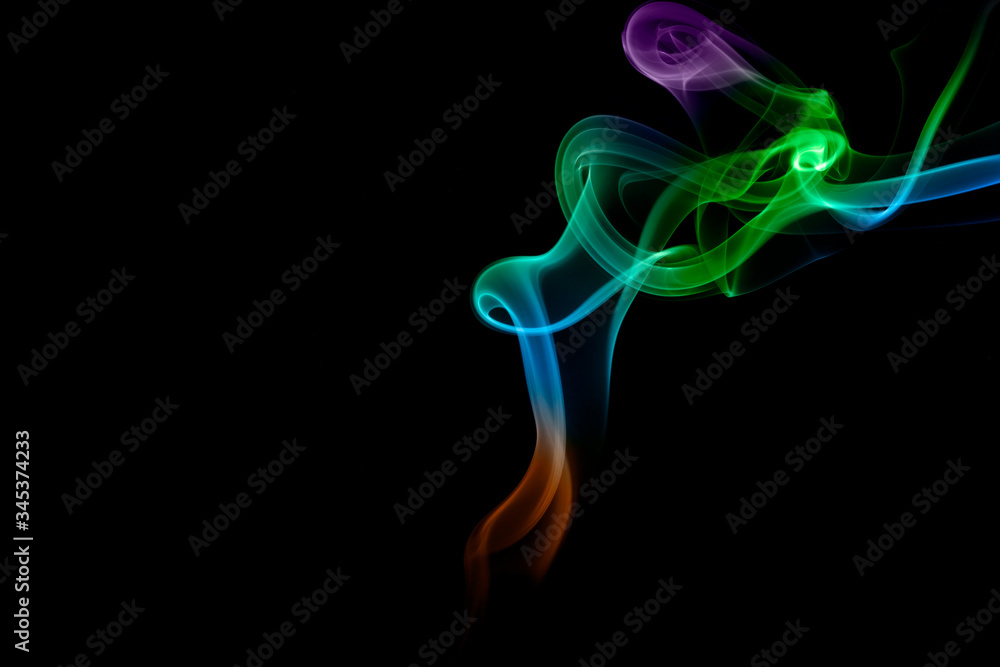 Abstract colored smoke on black background