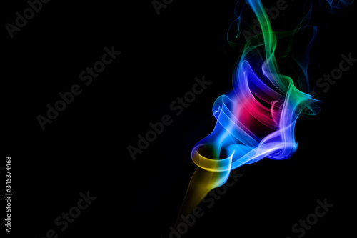 Abstract colored smoke on black background