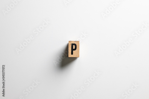 " P " text made of wooden cube on White background with clipping path.