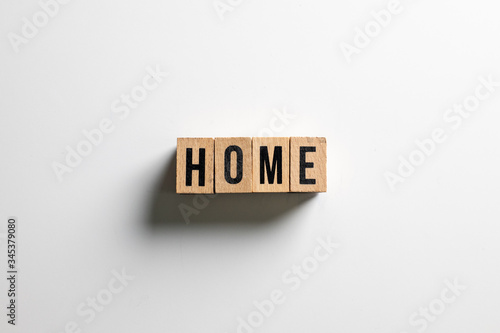 " home " text made of wooden cube on White background.