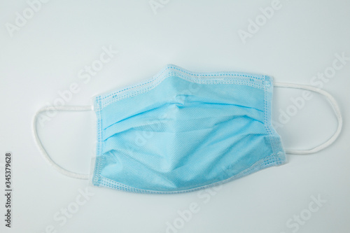 Top view, Surgical mask, with rubber ear straps. isolated on white background