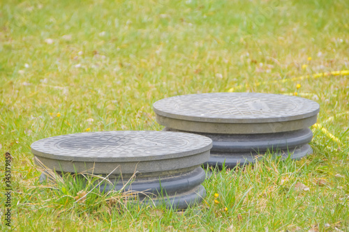 cover sewer in the grass on the garden plot