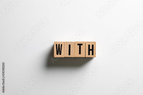 " with " text made of wooden cube on White background.