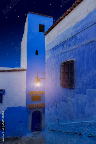 Arabian Night. Oriental tales. Magical night street in the blue city. Medina of Chefchaouen town, Morocco. Dreamy and romantic background. Luminous lantern in the dark. One thousand and one nights © Вера Тихонова