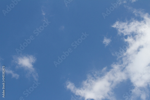 blue sky with high up white clouds while pollution free