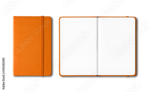 Orange closed and open notebooks isolated on white