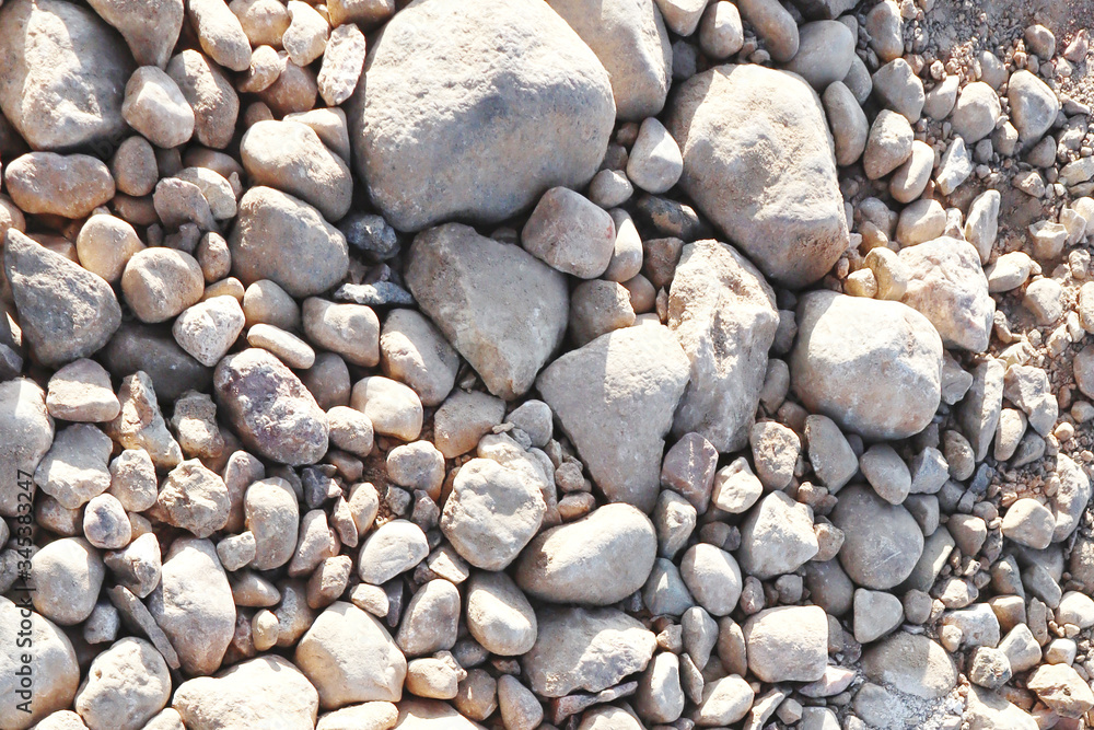 The word CRISIS in paper letters on the background of stones. Crisis concept. The word CRISIS in paper letters on the background of stones. Crisis concept.
