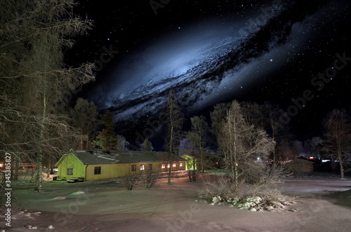  Sweden. Night sky over a snowy village