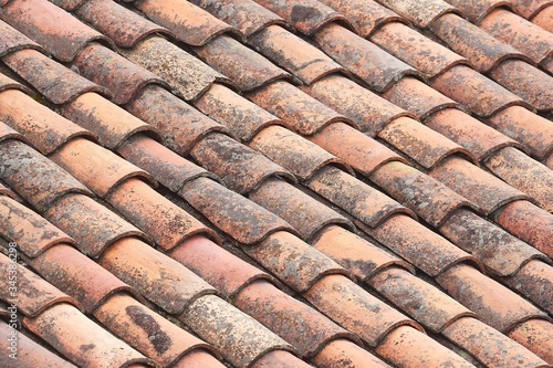 Roof with old stained tiles © Gudellaphoto