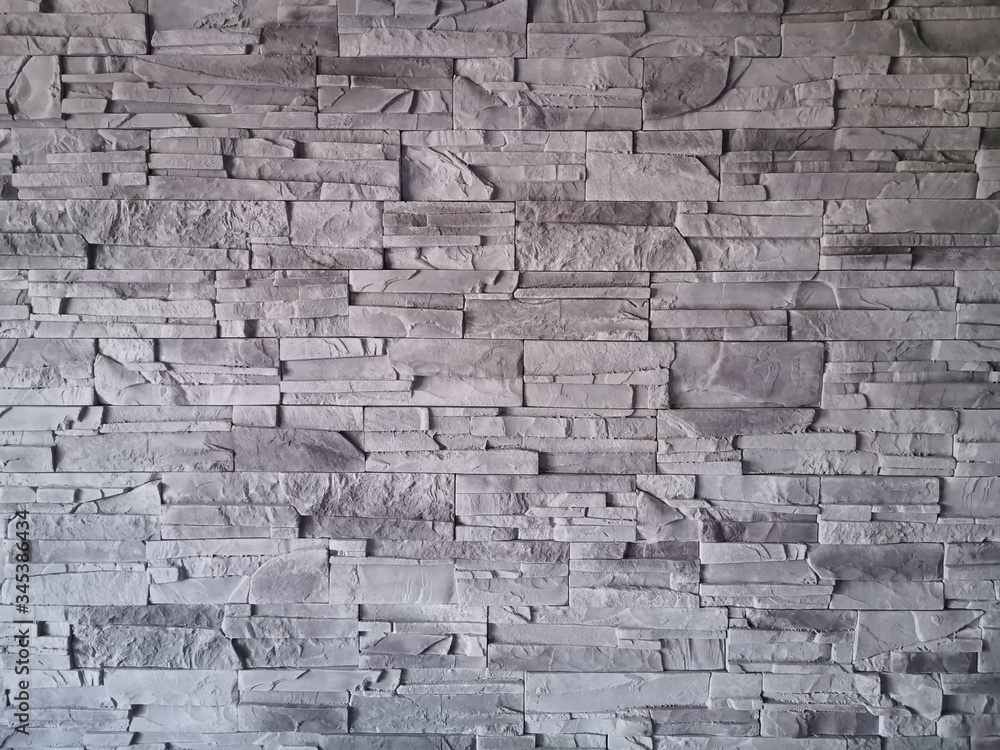 Naklejka premium Ściana z kamienia - szara