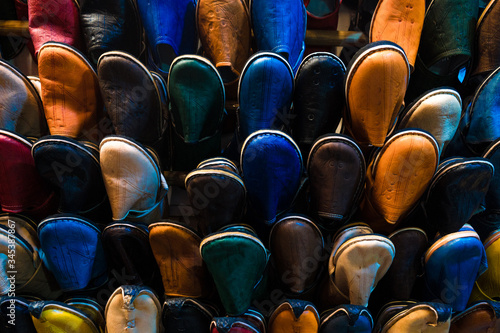 Typical morocan handcrafted colorful sandals in the souq of Marrakech photo