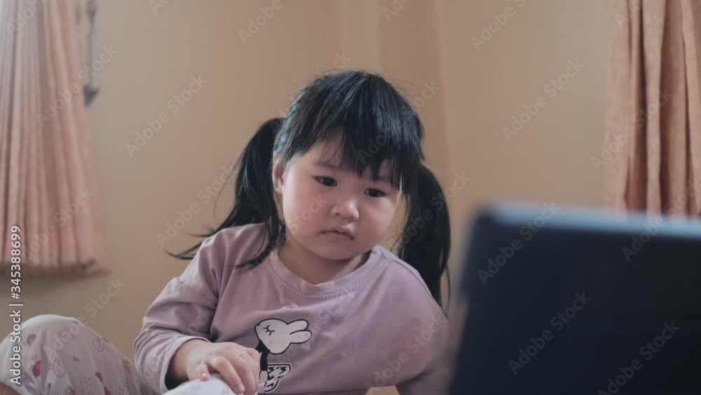 Asian young girl using laptop for education,Little asian girl using laptop to studying . Asian young girl using laptop for education,Little asian girl using laptop to studying .