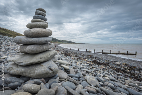 stack of stones on a stormy beach