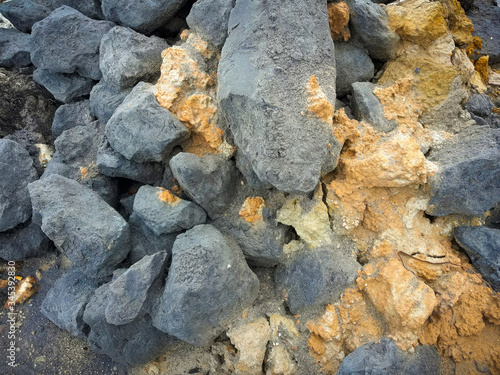 Titanium ore with silicon fragments. Photographed close-up. Horizontal frame. photo