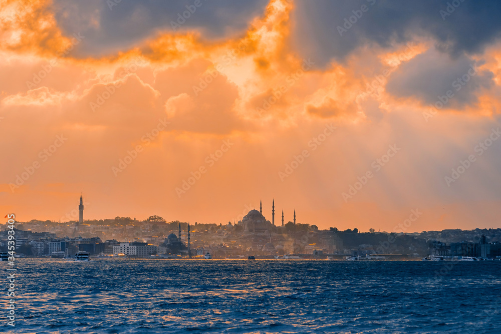 Naklejka premium Istanbul at sunset, Turkey. A boat trip on the Bosphorus at sunset. Concept of nice traveling and vacation in Istanbul.