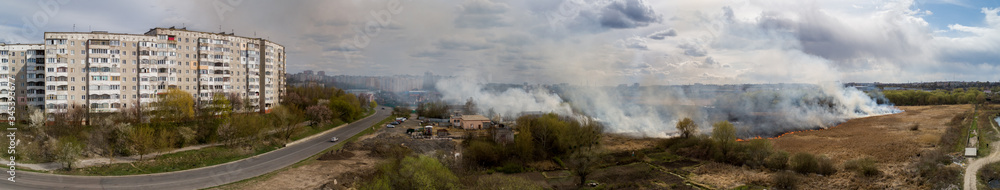 Large-scale fire in the field, lots of smoke and fire Rivne