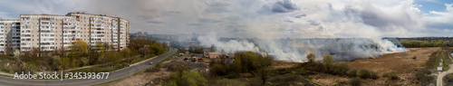 Large-scale fire in the field, lots of smoke and fire Rivne