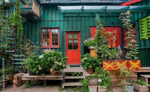 Photography Small terrace with plants in wooden village house of Christiania Freetown, old h