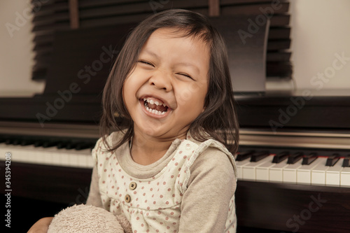 Little girl playing piano