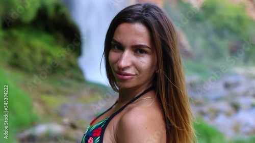 Young sexy model on Navajos waterfall background 