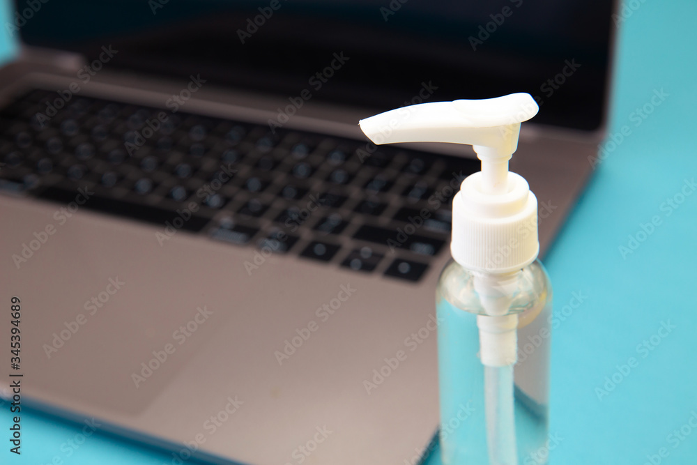Laptop with chemical spray for disinfection. Quarantine concept. Laptop with chemical spray for disinfection. Quarantine concept.