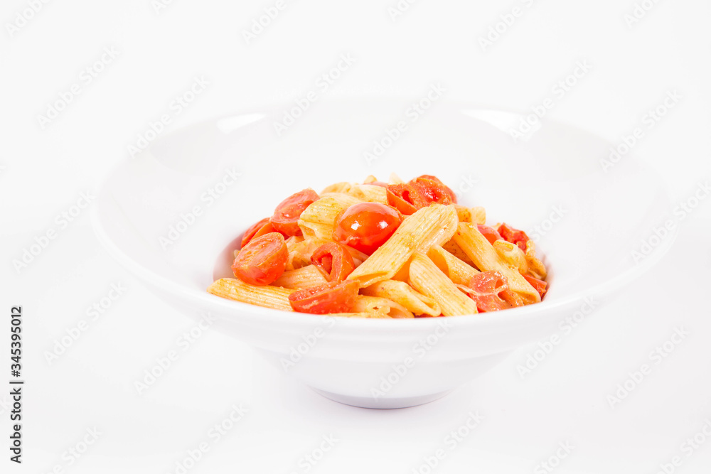 Penne with tomatoes, garlic and mozzarella on a white background Penne with tomatoes, garlic and mozzarella on a white background