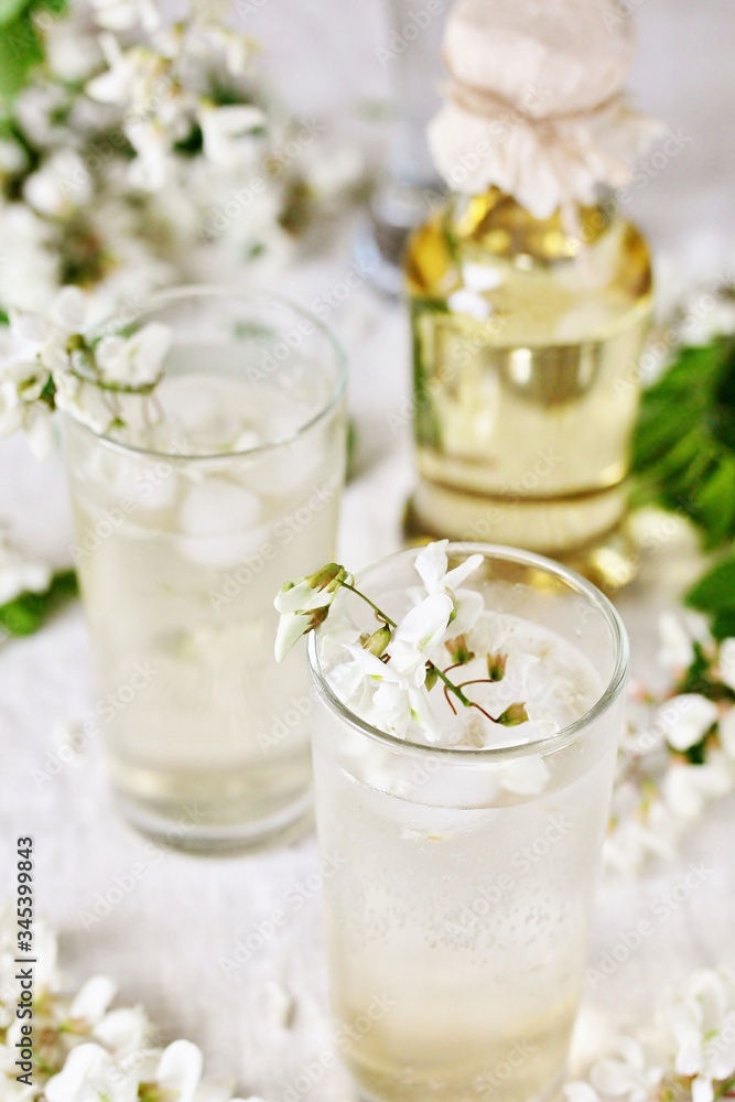 acacia flowers drink. lemonade with a syrup of white acacia flowers. Edible flowers. acacia flowers drink. lemonade with a syrup of white acacia flowers. Edible flowers.