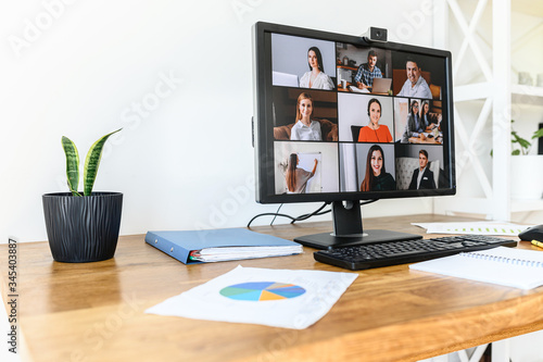 Online meeting, video call, video conference. App for video connection on pc in office, web shots of several people on the screen photo