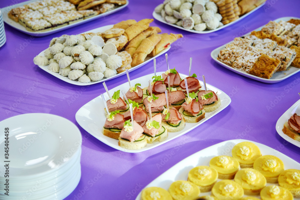 Banquet table with canapes and cookies Banquet table with canapes and cookies
