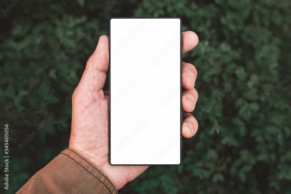 Smartphone screen mock up, man holding mobile phone Smartphone screen mock up, man holding mobile phone