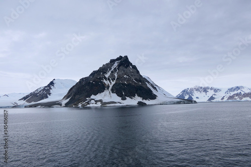 Wallpaper Mural Mountain in dark antarctic sea, cloudy and stormy sky, Antarctica Torontodigital.ca