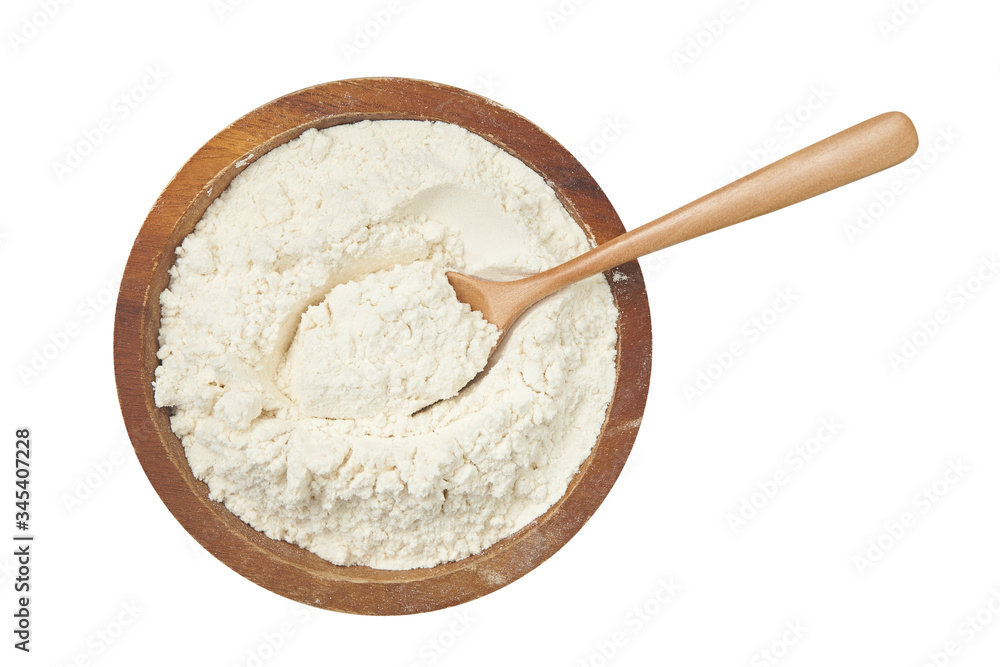 Top view of wooden spoon and bowl full of flour isolated on white Top view of wooden spoon and bowl full of flour isolated on white