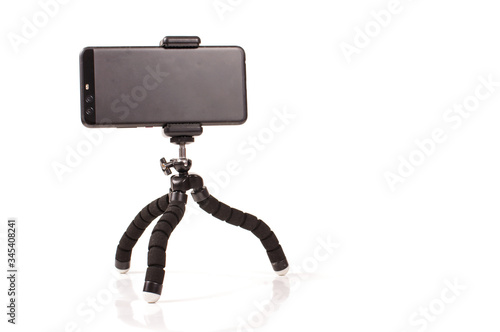 Universal smart phone tripod isolated on the white