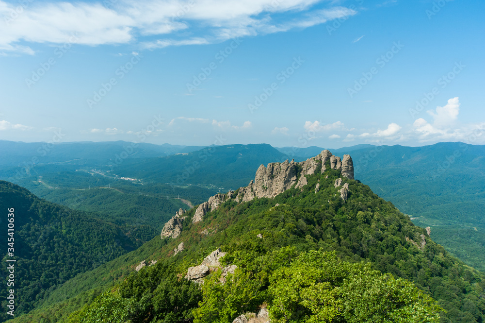 mountain view with a background of bright sun and blue sky. view of Turkey mountain. Russia, Krasnodar territory, Tuapsinsky district