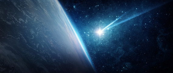 Comet, asteroid, meteorite flying to the Earth on the background of the starry night sky. .The concept on the theme of the apocalypse, armageddon, doomsday, Elements of this image furnished by NASA. 