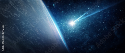 Fototapeta Naklejka Na Ścianę i Meble -  Comet, asteroid, meteorite flying to the Earth on the background of the starry night sky. .The concept on the theme of the apocalypse, armageddon, doomsday, Elements of this image furnished by NASA. 