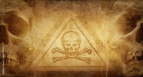 Symbol of dangerous and toxic substances surrounded by human skulls on a background of old paper. Good background on the topic of chemistry, alchemy, pharmaceuticals, poisons.