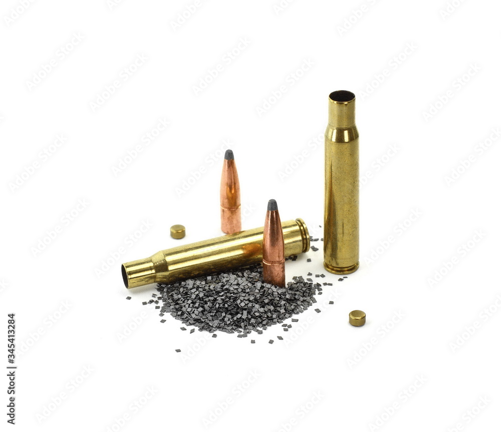 A rifle bullet, empty shell, gunpowder on white background. Hunting ammunition isolated on white. A rifle bullet, empty shell, gunpowder on white background. Hunting ammunition isolated on white.