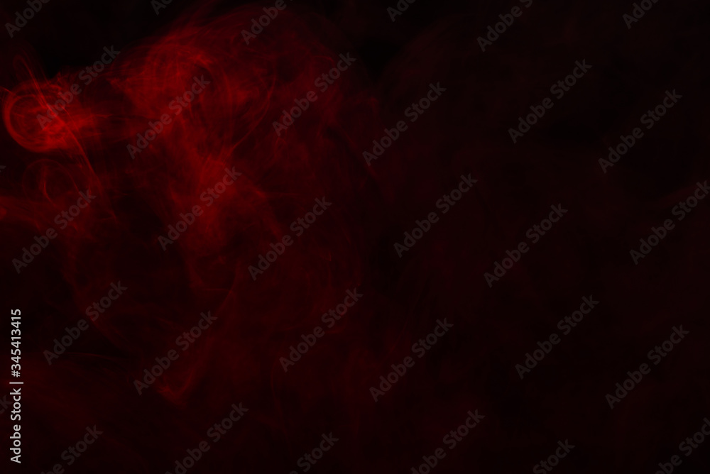 Fototapeta premium Red steam on a black background.