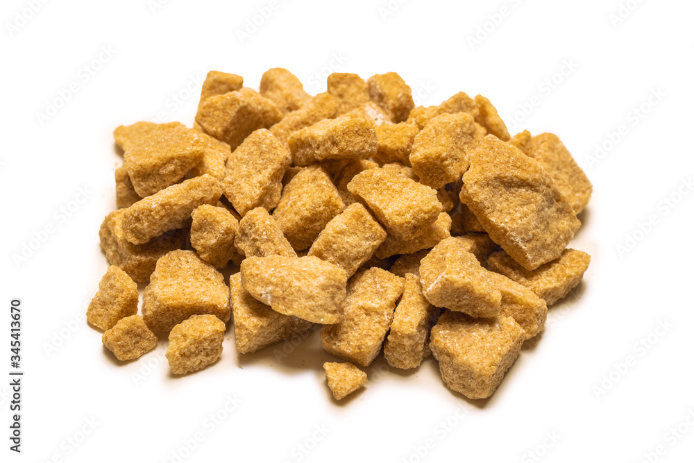 Brown sugar pieces isolated on white. Brown sugar pieces isolated on white.