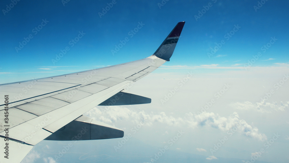 Fototapeta premium The Blue sky from the window of a plane. 