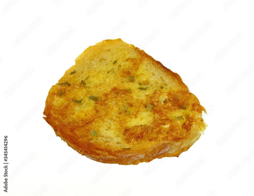 Slice of toasted bread with garlic and herbs isolated on white Slice of toasted bread with garlic and herbs isolated on white