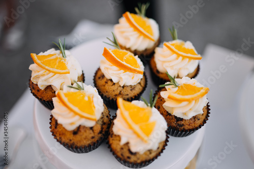 photo of orange cup cakes in a plate