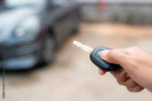 Hand press remote car.Concept finance.