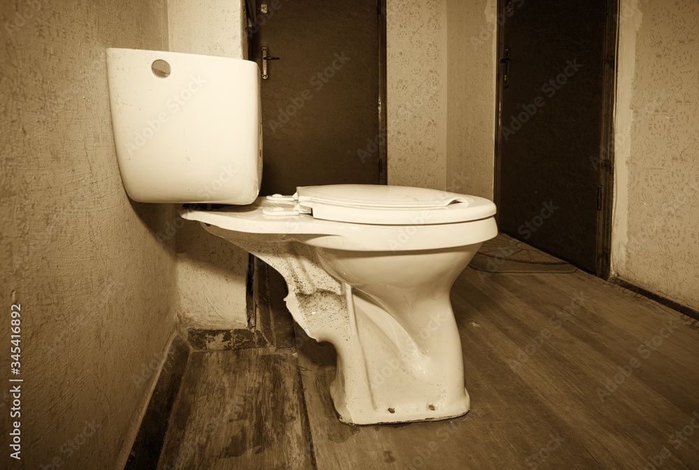 Multistorey residential building in the city. Replacing the old toilet