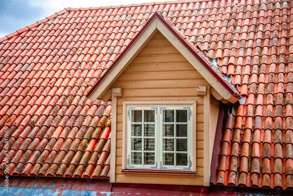 Red Tiled roofs of old city. Tallinn Estonia. Summer sunny day. View from above. roof window
