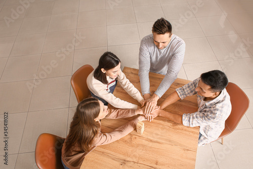 Team of business people put...