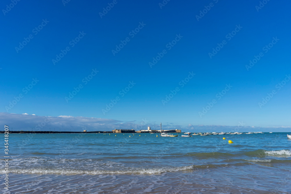 Sandy coast of the Mediterranean Sea within the city of Cadiz, Spain