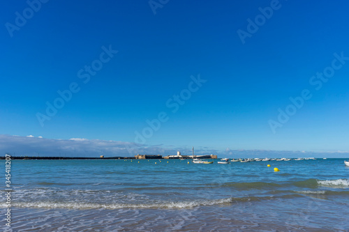 Sandy coast of the Mediterranean Sea within the city of Cadiz, Spain