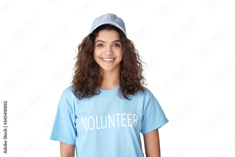 Smiling young hispanic latin girl in volunteer blue t-shirt looking at camera stand isolated on white studio background. Volunteerism, philanthropy, voluntary work concept. Closeup headshot portrait Smiling young hispanic latin girl in volunteer blue t-shirt looking at camera stand isolated on white studio background. Volunteerism, philanthropy, voluntary work concept. Closeup headshot portrait